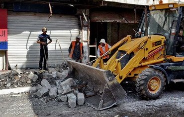 خانواده ها برای پشت سرگذاشتن موانع و بازگشت به دشت های نینوا دل به دریا می زنند
