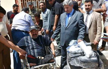 مساعدة المعوقين من أهالي الأنبار الذين تضرروا من قبل داعش