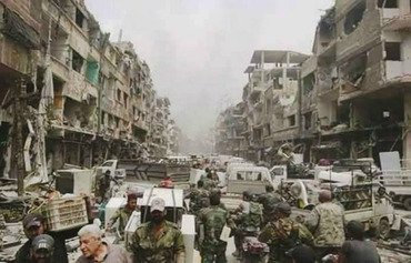 انتشار عمليات النهب يهدد ما تبقى من مخيم اليرموك