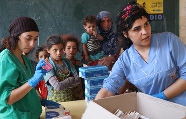 ارتش آزاد سوریه برای غیرنظامیان در هجین کمک های پزشکی فراهم می کند