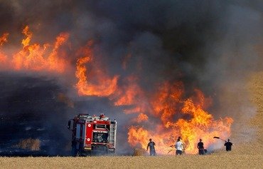 حرائق تلتهم مساحات شاسعة من الحقول الزراعية في العراق