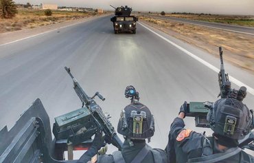 العراق يعتقل 14 مقاتلا مواليا لإيران على خلفية هجمات صاروخية