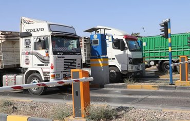تكبد سائقي الشاحنات العراقيين الخسائر جراء ابتزاز الميليشيات
